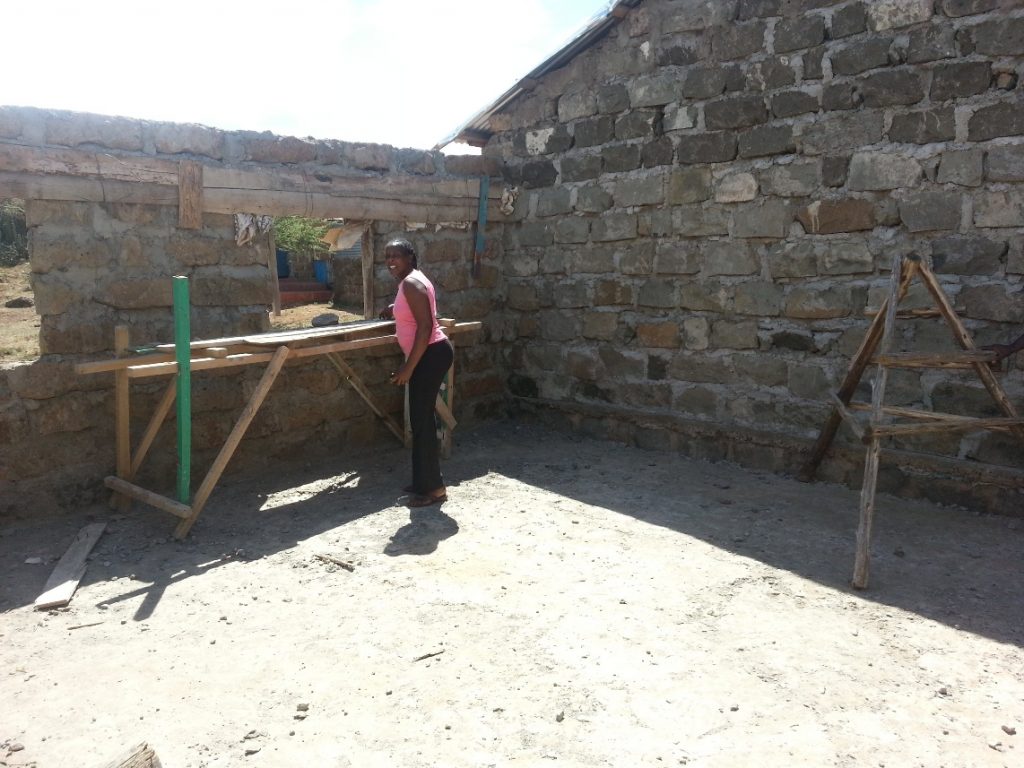 Headmistress/Teacher Mary Naipanoi Tobiko at work on the new classroom