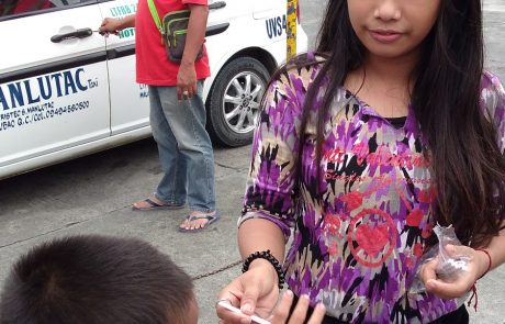 Sunshaine Bujawe 6th grade helping a child Oct 2017